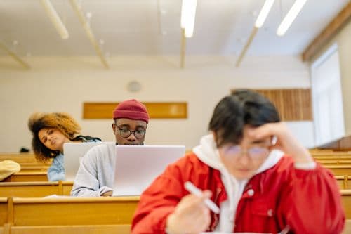 Students concentrating on their studies in a lecture room